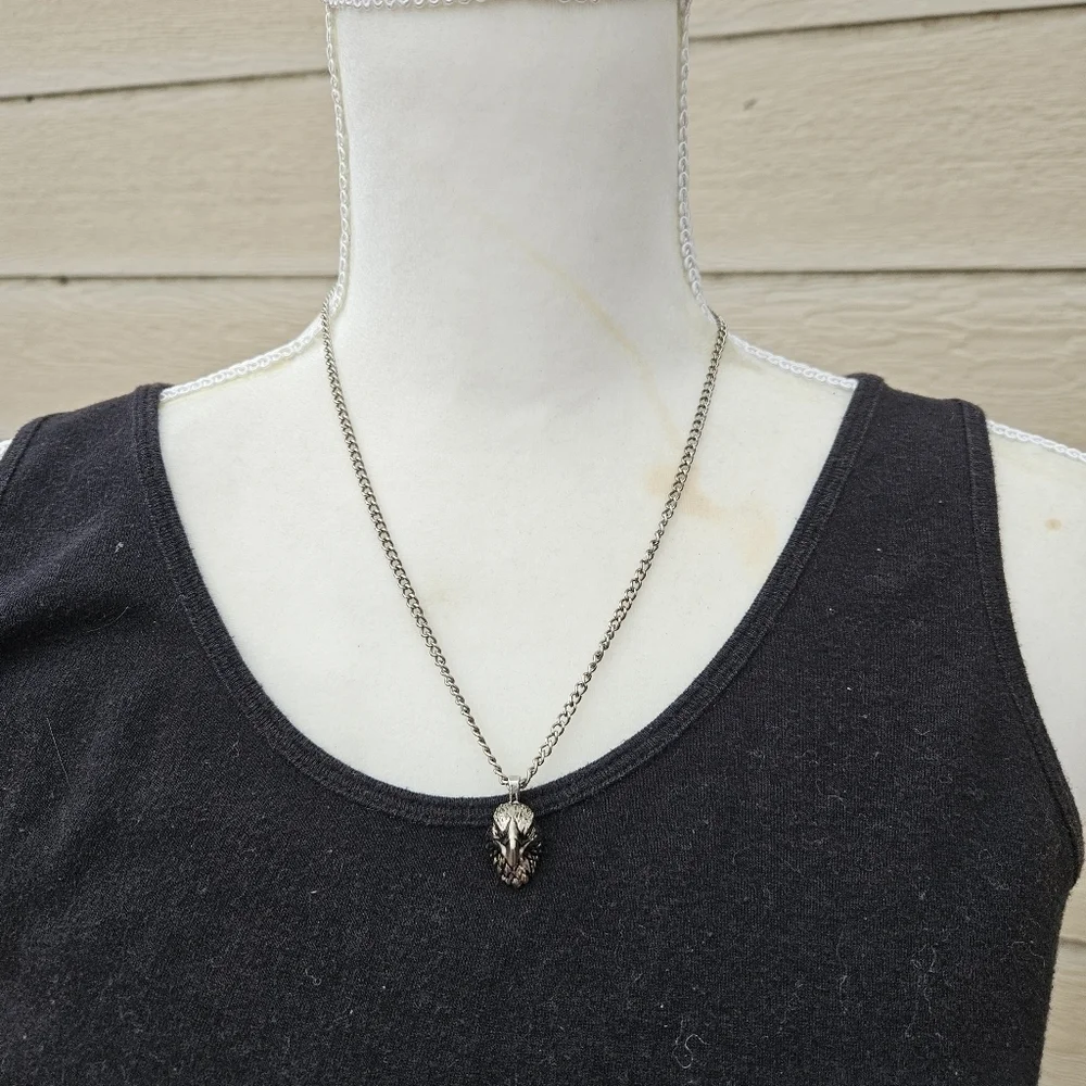 silver tone chain with eagle head pendant